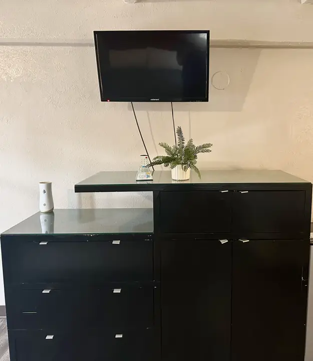 Dresser with a wall-mounted TV